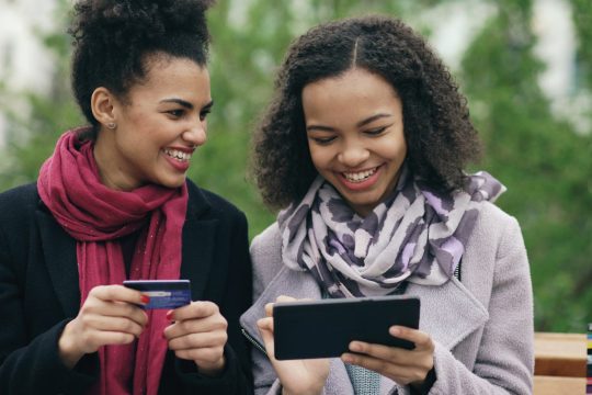 Young women with Phone and card